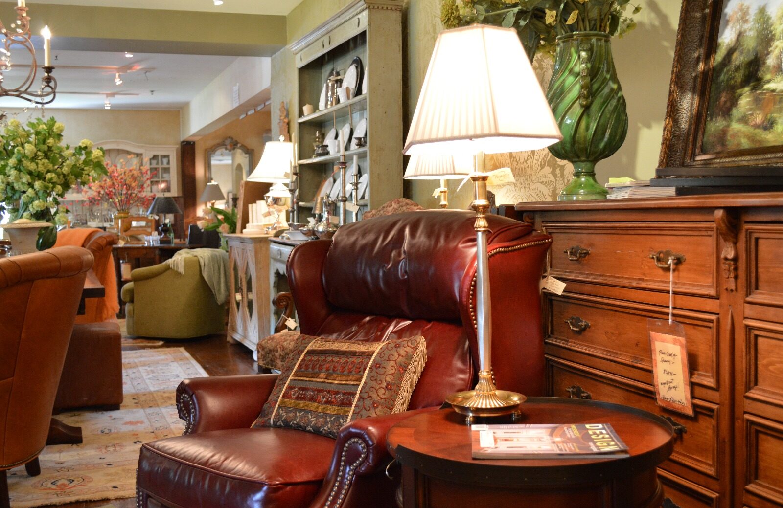 Showroom — burgundy leather sofa and bookshelves