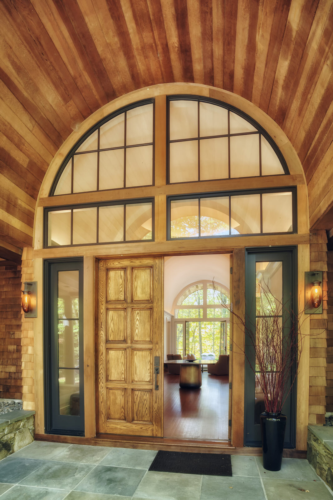 Front door detail under barrel-vaulted portico