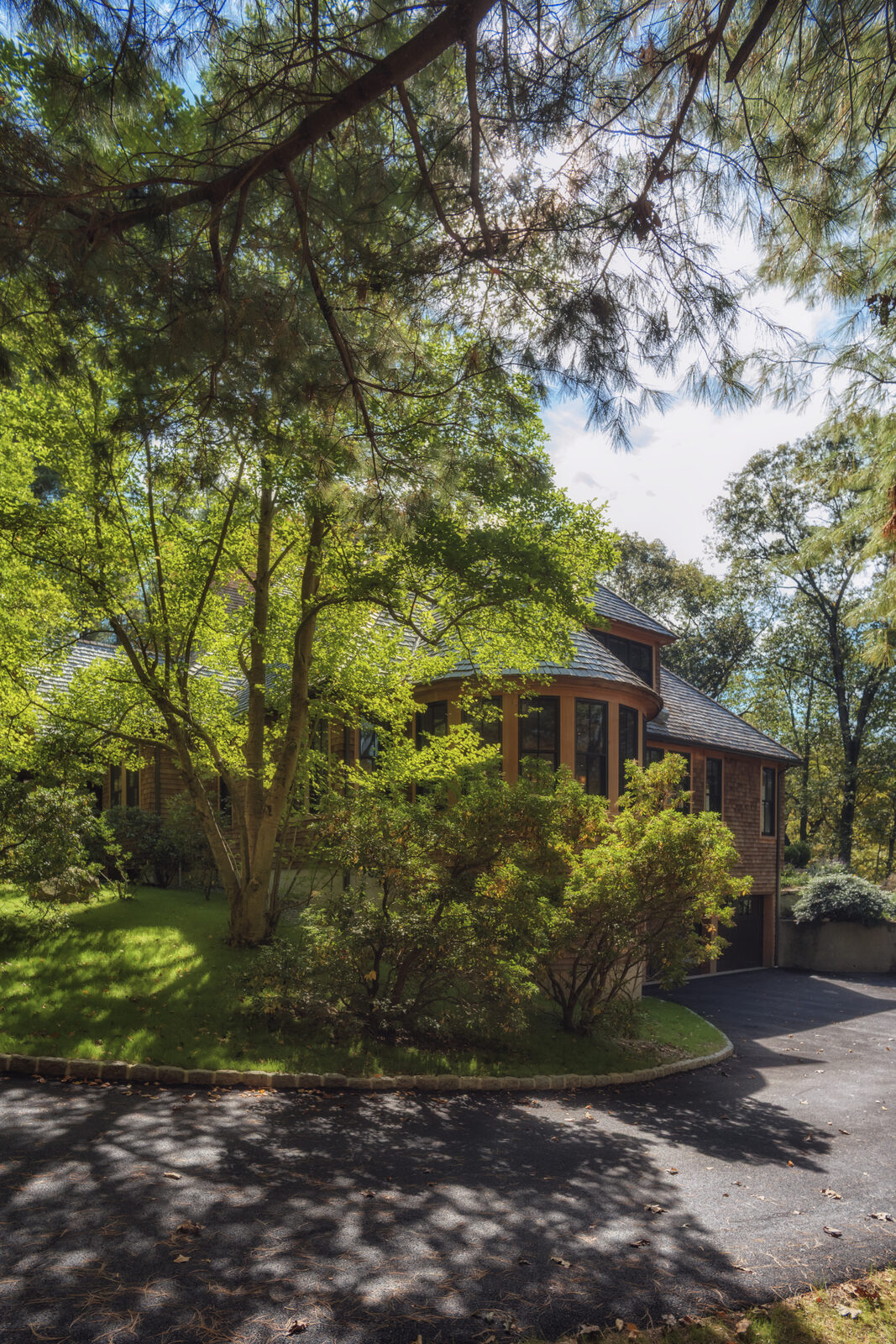 Side elevation with turret bay and driveway